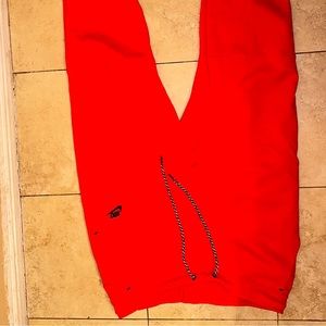 Red nike tech joggers
